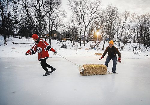 JOHN WOODS / WINNIPEG FREE PRESS
Eric Reder and his son North, 14, get their skating rinks on the Seine River ready for the winter season Monday, December 12, 2022. The pair is having a get together for North&#x2019;s hockey team later this week.

Re: rachel