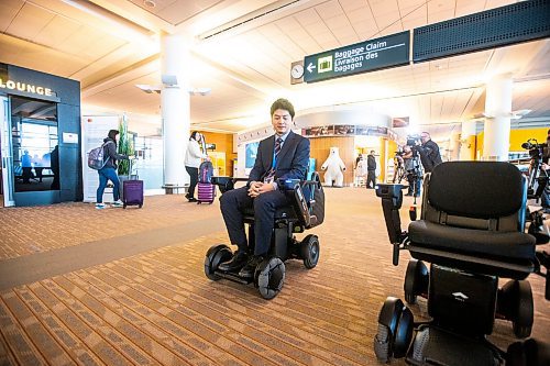 MIKAELA MACKENZIE / WINNIPEG FREE PRESS

Yuta Okumura, director of autonomous program implementation at Scootaround / WHILL demonstrates the new self-driving wheelchairs (the first of their kind in North America) at the Winnipeg James Armstrong Richardson International Airport in Winnipeg on Tuesday, Dec. 13, 2022. For Marty Cash story.
Winnipeg Free Press 2022.