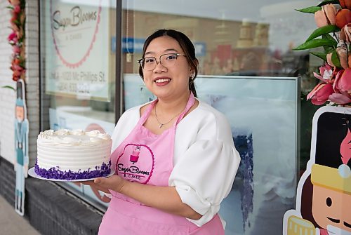 JESSICA LEE / WINNIPEG FREE PRESS

Marie Mallari of Sugar Blooms and Cakes holds a Ube cake on December 13, 2022 at the bakery. The Ube cake won a Food Network baking competition, beating out two American teams.

Reporter: Rachel