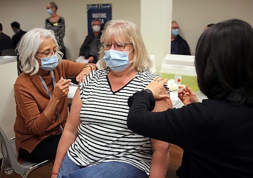 Vaccine recipient Sue, who didn't provide her last name, is happy to have a COVID-19 and flu shot at the same time. The clinic is run by Prairie Mountain Health in Shoppers Mall. Walk-ins are accepted, appointments are encouraged. (Photos by Michele McDougall/The Brandon Sun)