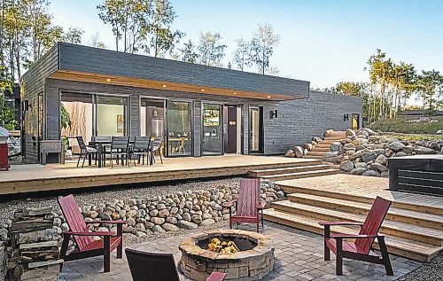 Den 12 near Riding Mountain National Park features a fireplace, outdoor fire pit, heated floors, AC, private outdoor hot tub and a large deck all wrapped in a contemporary cabin vibe. (Winnipeg Free Press Files)