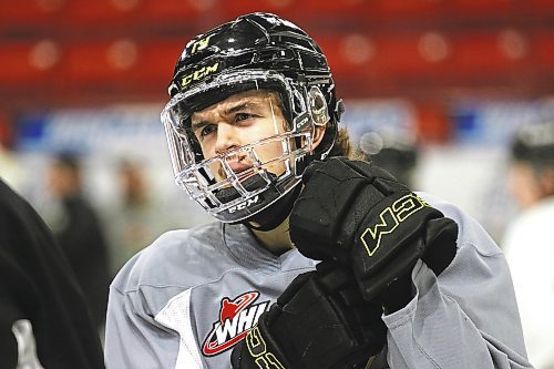 Wheat Kings forward Jake Chiasson wears a full cage on Thursday after sustaining a cut on his lip at practice on Wednesday. (Perry Bergson/The Brandon Sun)