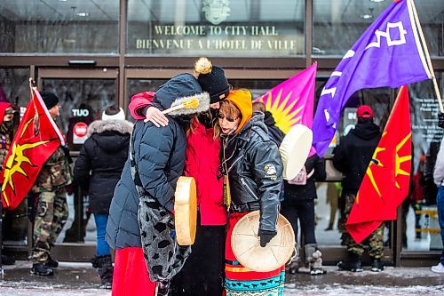 MIKAELA MACKENZIE / WINNIPEG FREE PRESS

Cedar (left), Taylor Orpin, and Sue Caribou hug at a rally demanding justice for the murdered Indigenous women whose bodies are believed to be in landfills at City Hall in Winnipeg on Thursday, Dec. 15, 2022. For Erik Pindera story.
Winnipeg Free Press 2022.