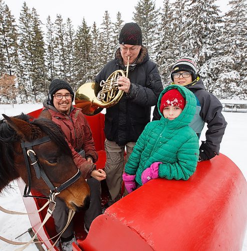 MIKE DEAL / WINNIPEG FREE PRESS
Ken MacDonald (centre) is a hornist with the Winnipeg Symphony Orchestra. His husband Trevor Kirczenow (left) is a horse trainer and freelance violinist. Both are looking forward to playing &quot;The Nutcracker&quot; again with the Royal Winnipeg Ballet this Christmas. Many Manitoban children will already know their Ojibwe Horse, Asemaa'kwe, from her starring role in &quot;The Spirit Horse Returns.&quot; This show about these critically-endangered horses was premiered by the Winnipeg Symphony Orchestra earlier this season and will be performed with the Thunder Bay Symphony Orchestra in April. Along with their children Matthew (right) and Piper (second from right), they are training Asemaa'kwe to pull a sleigh this year.
See Holly Harris story
221215 - Thursday, December 15, 2022.