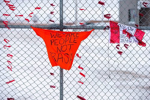 MIKAELA MACKENZIE / WINNIPEG FREE PRESS

Red dresses, flags, and orange shirts hang outside of the Brady landfill in Winnipeg on Thursday, Dec. 15, 2022. For Erik Pindera story.
Winnipeg Free Press 2022.