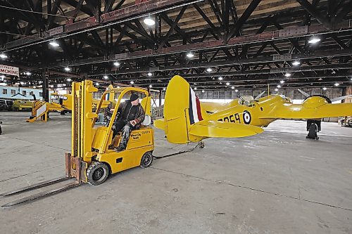 John McNarry moves a Bristol Bolingbroke plane with a forklift at the Commonwealth Air Training Plan Museum on Friday morning. (Colin Slark/The Brandon Sun)