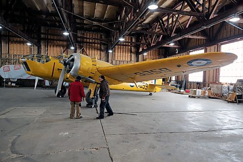 Art Brown (left) and John McNarry (right) inspect their work after moving a Bristol Bolingbroke plane in the hangar of the Commonwealth Air Training Plan Museum on Friday. (Colin Slark/The Brandon Sun)