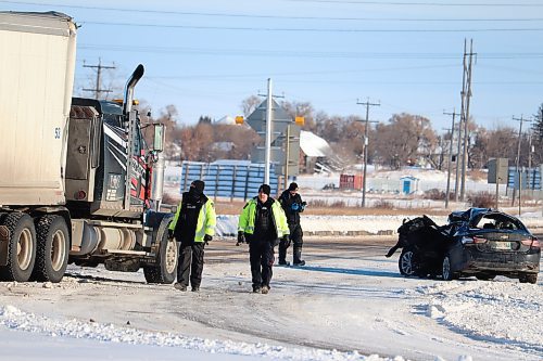 Brandon police officers block off eastbound lanes heading out of the city Saturday afternoon to investigate a major traffic collision that took place at the intersection of First Street and the Trans-Canada Highway earlier that morning. (Kyle Darbyson/The Brandon Sun)