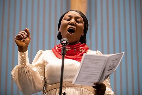 Daniel Crump / Winnipeg Free Press. Pelumi Ruth Enejoh sings Christmas songs during Carols of Christmas: The Greatest Story Ever Told at the Apostolic Faith Church in Winnipeg. December 18, 2022.