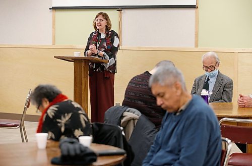 JOHN WOODS / WINNIPEG FREE PRESS
Reverend Lesley Harrison prays with parishioners at a community meal after a service at Knox United Church in Winnipeg Sunday, December 18, 2022. Knox United Church is an intercultural church and community hub in the heart of the Central Park neighbourhood of Winnipeg.

Re: Marten
