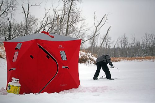 A Brandon man does a little ice fishing on a frosty Monday morning out on the Assiniboine River near the Riverbank Discovery Centre. (Matt Goerzen/The Brandon Sun)