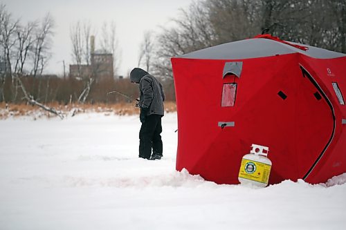 A Brandon man does a little ice fishing on a frosty Monday morning out on the Assiniboine River near the Riverbank Discovery Centre. (Matt Goerzen/The Brandon Sun)