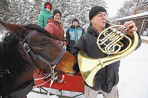 MIKE DEAL / WINNIPEG FREE PRESS
Ken MacDonald (right) is a hornist with the Winnipeg Symphony Orchestra. His husband Trevor Kirczenow (second from left) is a horse trainer and freelance violinist. Both are looking forward to playing &quot;The Nutcracker&quot; again with the Royal Winnipeg Ballet this Christmas. Many Manitoban children will already know their Ojibwe Horse, Asemaa'kwe, from her starring role in &quot;The Spirit Horse Returns.&quot; This show about these critically-endangered horses was premiered by the Winnipeg Symphony Orchestra earlier this season and will be performed with the Thunder Bay Symphony Orchestra in April. Along with their children Matthew (second from right) and Piper (left), they are training Asemaa'kwe to pull a sleigh this year.
See Holly Harris story
221215 - Thursday, December 15, 2022.