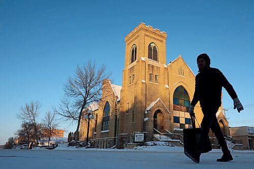 A bundled-up pedestrian walks past the Redeemed Christian Church of God Restoration Parish on Louise Avenue in Brandon on a bitterly cold Tuesday. (Tim Smith/The Brandon Sun)