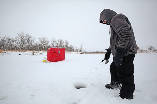 A Brandon man, who asked to remain anonymous, tries his luck fishing on the Assiniboine River earlier this week. Environment Canada is expecting extreme-cold temperatures to remain over Westman until the weekend. See more information on page A2. (Matt Goerzen/The Brandon Sun)