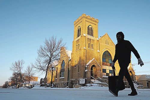 20122022
A bundled up pedestrian walks past the Redeemed Christian Church of God Restoration Parish on Louise Avenue in Brandon on a bitterly cold Tuesday.   (Tim Smith/The Brandon Sun)