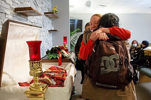 MIKE DEAL / WINNIPEG FREE PRESS

Brenda Myran is hugged by Michelle Myran, 36, foster sister to her son, Joseph Matthew Myran, 36, during his memorial at Eternal Grace Funerals, 1111 Logan Avenue, Wednesday afternoon.

Matthew was killed Jan. 17 at an apartment on the 800 block of Main Street. 

The Winnipeg Police are still investigating.

See Erik Pindera story

220126 - Wednesday, January 26, 2022.