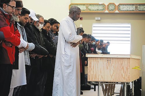 RUTH BONNEVILLE / WINNIPEG FREE PRESS 

LOCAL - Cyclist's funeral 

Photo of Yacine Mamadou, Imam who resided over the funeral service offering prayers for Javed Musharraf on Wednesday along with members of the community. 


A funeral was held for 22-year-old Javed Musharraf, an international exchange student from India, at Manitoba Islamic Association (MIA) Grand Mosque on Waverley,  Wednesday.  

Musharraf was killed when he collided with a front-end loader while riding his bike home later in the evening on Dec 15th.  Approximately 80 members of the community held a funeral service for Javed Musharraf including roommates, Mohsin Ahmed and Shakih Shaikh (blue turban), that knew him well. His family members do not reside in Winnipeg and could not attend his service in person. 

See Erik's story. 

Dec 21st,  2022