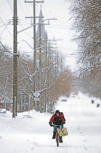 21122022
A cyclist makes their way along Lorne Avenue East in Brandon on a snowy and cold Wednesday.  (Tim Smith/The Brandon Sun)