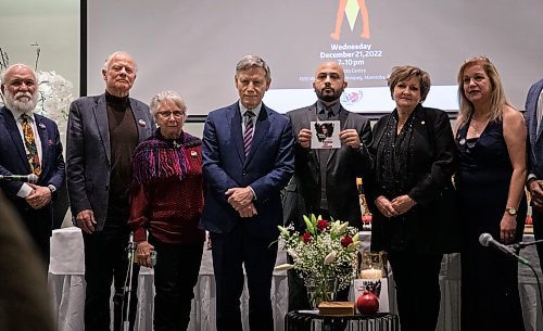 JESSICA LEE / WINNIPEG FREE PRESS
Arian Arianpour (holding photo), president of the Iranian Community of Manitoba, says Yalda Night this year is tinged with sorrow after hundreds have been killed by Iranian authorities after protests erupted  over the police murder of a 22-year-old woman.
