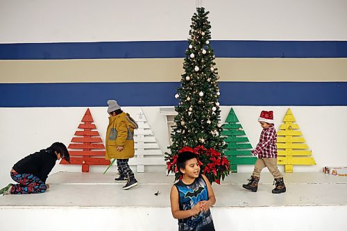 Children play on a decorated stage during the annual Christmas dinner at the Sioux Valley Dakota Nation Veterans Hall on Thursday evening. (Tim Smith/The Brandon Sun)