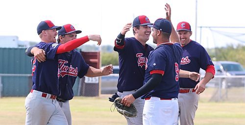 After the final out in their 1-0 victory over the Rivers Comets in the senior AA final in Rivers, Cartwright Twins players Drew Haight (12), Bryce Enns (4), Ty Enns (2), Anthony Friesen (9) and Connor Drewry (5) embrace at the mound. (Perry Bergson/The Brandon Sun)