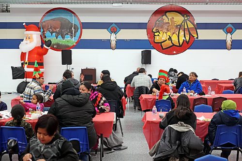 22122022
Members of Sioux Valley Dakota Nation dine and socialize during the annual Christmas Dinner at the SVDN Veterans Hall on Thursday evening. Sioux Valley also held dinners in Winnipeg and Brandon for members of the First Nation in those cities earlier this month and will hold a final dinner today for community elders. This was the first community Christmas Dinner in three years at Sioux Valley as the dinners for 2020 and 2021 were cancelled due to the COVID-19 pandemic.  (Tim Smith/The Brandon Sun)