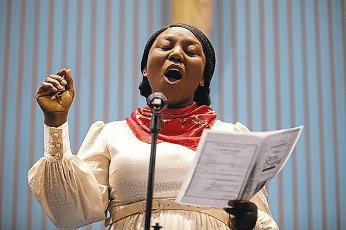 Daniel Crump / Winnipeg Free Press. Pelumi Ruth Enejoh sings Christmas songs during Carols of Christmas: The Greatest Story Ever Told at the Apostolic Faith Church in Winnipeg. December 18, 2022.