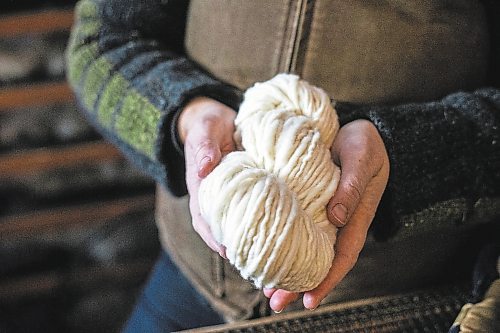 MIKAELA MACKENZIE / WINNIPEG FREE PRESS

Anna Hunter, co-director of Pembina Fibreshed, shows a skein of local wool at her mill east of Winnipeg on Tuesday, Dec. 6, 2022. For green page story.
Winnipeg Free Press 2022.