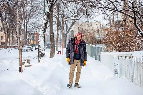 MIKAELA MACKENZIE / WINNIPEG FREE PRESS

Downtown resident Brian Pincott poses for a photo on his street in Winnipeg on Thursday, Dec. 22, 2022. He says that improving active transport infrastructure is key to having more people live in the core. For Malak story.
Winnipeg Free Press 2022.