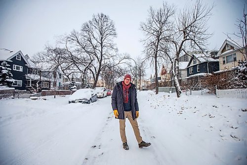 MIKAELA MACKENZIE / WINNIPEG FREE PRESS

Downtown resident Brian Pincott poses for a photo on his street in Winnipeg on Thursday, Dec. 22, 2022. He says that improving active transport infrastructure is key to having more people live in the core. For Malak story.
Winnipeg Free Press 2022.