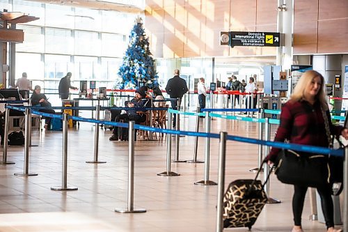 MIKAELA MACKENZIE / WINNIPEG FREE PRESS

Winnipeg Richardson International Airport, where many flights are being cancelled or delayed this holiday season due to storms in Ontario and BC, in Winnipeg on Friday, Dec. 23, 2022. For Katie story.
Winnipeg Free Press 2022.