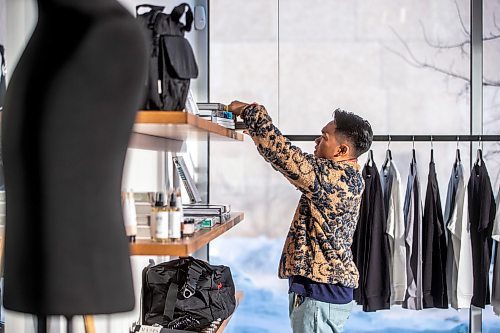 MIKAELA MACKENZIE / WINNIPEG FREE PRESS

Daniel Basanes, co-creator of Hobbyism (a new menswear store opening this Boxing Day), styles shelves in the shop on Colony Street in Winnipeg on Friday, Dec. 23, 2022. For Gabby story.
Winnipeg Free Press 2022.