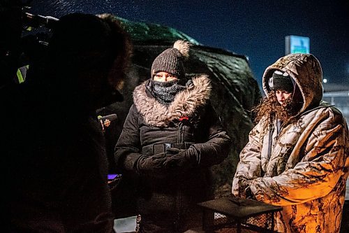 MIKAELA MACKENZIE / WINNIPEG FREE PRESS

Melissa Normand (left) and Cambria Harris speak to the media before going up to the landfill for a ceremony at the Brady landfill in Winnipeg on Friday, Dec. 23, 2022. For Erik story.
Winnipeg Free Press 2022.