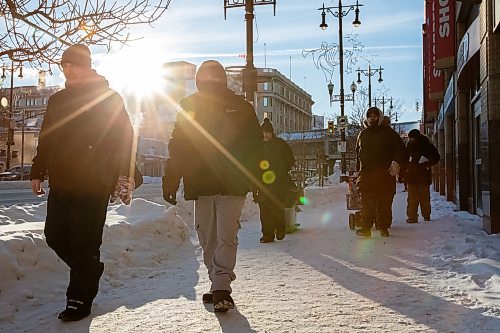 Daniel Crump / Winnipeg Free Press. Volunteers from Warmer Hearts Winnipeg hand out hot chocolate, soup, and clothing to anyone who wants some in downtown Winnipeg. December 24, 2022.