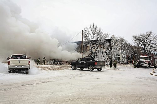 More than 12 hours after the fire that destroyed the Gladstone Hotel started, firefighters were still on scene watching for flare-ups and hot spots. (Colin Slark/The Brandon Sun)