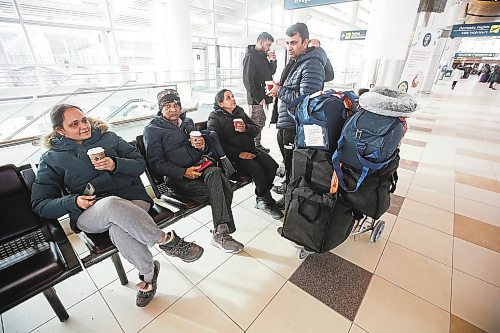 JOHN WOODS / WINNIPEG FREE PRESS
Khushbu Patel, left, assists Bharatbhai Patel, centre and his wife Meenaben, (not shown) as they wait at Winnipegճ airport as they try to board a flight to India Sunday, December 25, 2022. Air companies have been struggling with delays and cancellations due to weather.

Re: Abas