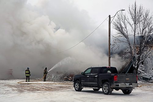 Firefighters spray waters on the embers of a fire that destroyed the Gladstone Hotel on the afternoon of Dec. 25. (Colin Slark/The Brandon Sun)