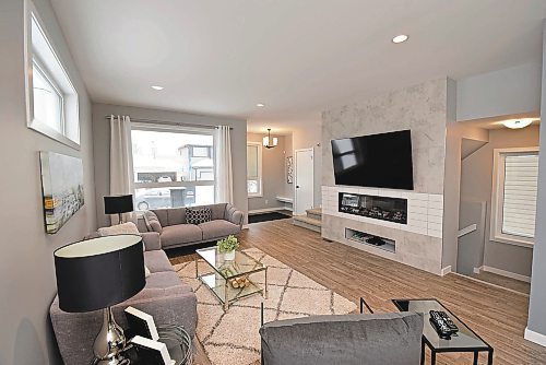 Photos by Todd Lewys / Winnipeg Free Press

The great room's focal point is a feature wall with a faux-finished TV nook and electric linear fireplace.