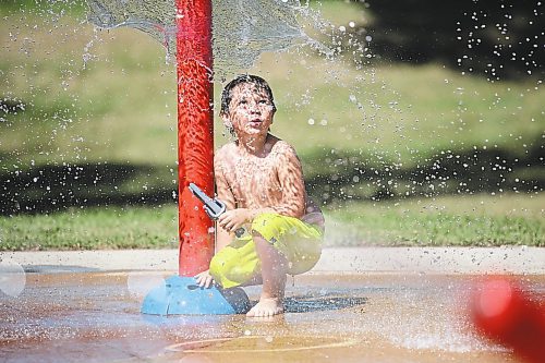 Brandon Sun Six-year-old Leon McLenon watches the water spray at the Rideau water park on a sunny and hot Tuesday afternoon. (Matt Goerzen/The Brandon Sun)