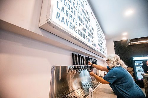 MIKAELA MACKENZIE / WINNIPEG FREE PRESS

Frances Gauthier pours a beer at the Devil May Care taproom, which opened December 23rd at Fort Street and York Avenue, in Winnipeg on Wednesday, Dec. 28, 2022. For Marty Cash story.
Winnipeg Free Press 2022.