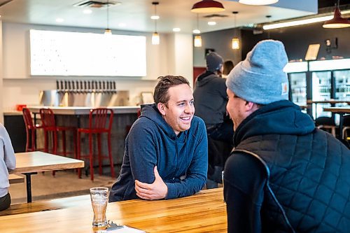 MIKAELA MACKENZIE / WINNIPEG FREE PRESS

Ryan Van Berkel enjoys a beer at the Devil May Care taproom, which opened December 23rd at Fort Street and York Avenue, in Winnipeg on Wednesday, Dec. 28, 2022. For Marty Cash story.
Winnipeg Free Press 2022.