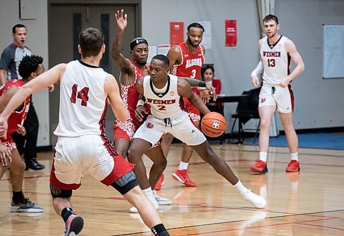 JESSICA LEE / WINNIPEG FREE PRESS

University of Winnipeg Wesmen player Emmanuel Thomas (2) dribbles the ball during a game against the University of Algoma Thunderbirds at the Duckworth Centre on December 28, 2022.

Reporter: Mike Sawatzky