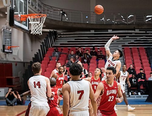 JESSICA LEE / WINNIPEG FREE PRESS

University of Winnipeg Wesmen player Shawn Maranan (5) throws the ball into the net during the last few seconds of period one in a game against the University of Algoma Thunderbirds at the Duckworth Centre on December 28, 2022.

Reporter: Mike Sawatzky