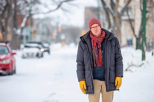 MIKAELA MACKENZIE / WINNIPEG FREE PRESS

Downtown resident Brian Pincott poses for a photo on his street in Winnipeg on Thursday, Dec. 22, 2022. He says that improving active transport infrastructure is key to having more people live in the core. For Malak story.
Winnipeg Free Press 2022.