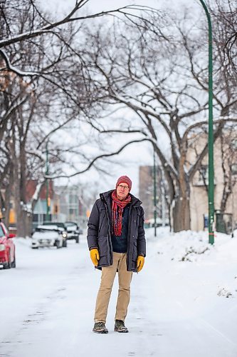 MIKAELA MACKENZIE / WINNIPEG FREE PRESS

Downtown resident Brian Pincott poses for a photo on his street in Winnipeg on Thursday, Dec. 22, 2022. He says that improving active transport infrastructure is key to having more people live in the core. For Malak story.
Winnipeg Free Press 2022.