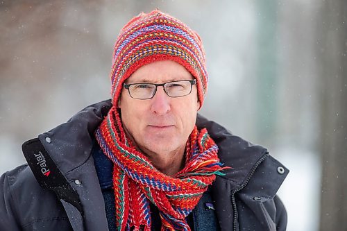 MIKAELA MACKENZIE / WINNIPEG FREE PRESS

Downtown resident Brian Pincott poses for a photo on his street in Winnipeg on Thursday, Dec. 22, 2022. He says that improving active transport infrastructure is key to having more people live in the core. For Malak story.
Winnipeg Free Press 2022.