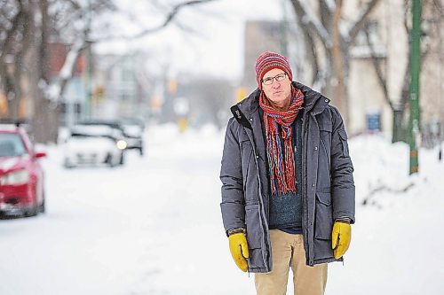 MIKAELA MACKENZIE / WINNIPEG FREE PRESS

Downtown resident Brian Pincott poses for a photo on his street in Winnipeg on Thursday, Dec. 22, 2022. He says that improving active transport infrastructure is key to having more people live in the core. For Malak story.
Winnipeg Free Press 2022.