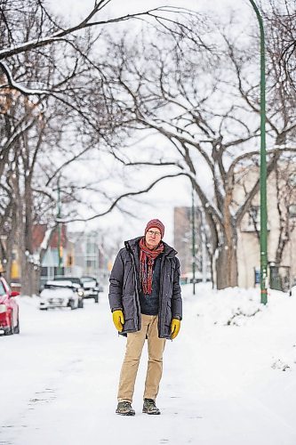 MIKAELA MACKENZIE / WINNIPEG FREE PRESS

Downtown resident Brian Pincott poses for a photo on his street in Winnipeg on Thursday, Dec. 22, 2022. He says that improving active transport infrastructure is key to having more people live in the core. For Malak story.
Winnipeg Free Press 2022.