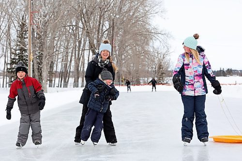 Laurel Loewen and her children Kaelem, Phoebe and Evallete skate together at the Brandon Skating Oval on a mild Thursday. (Tim Smith/The Brandon Sun)